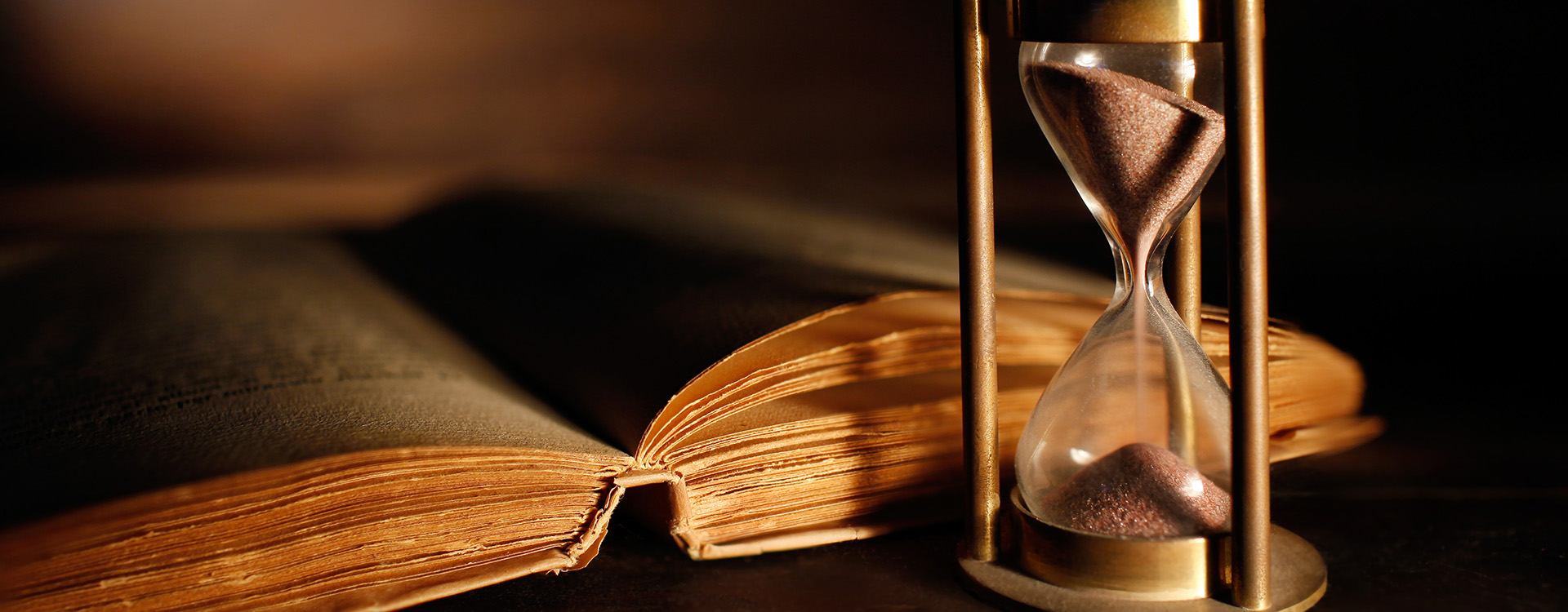 hourglass and book