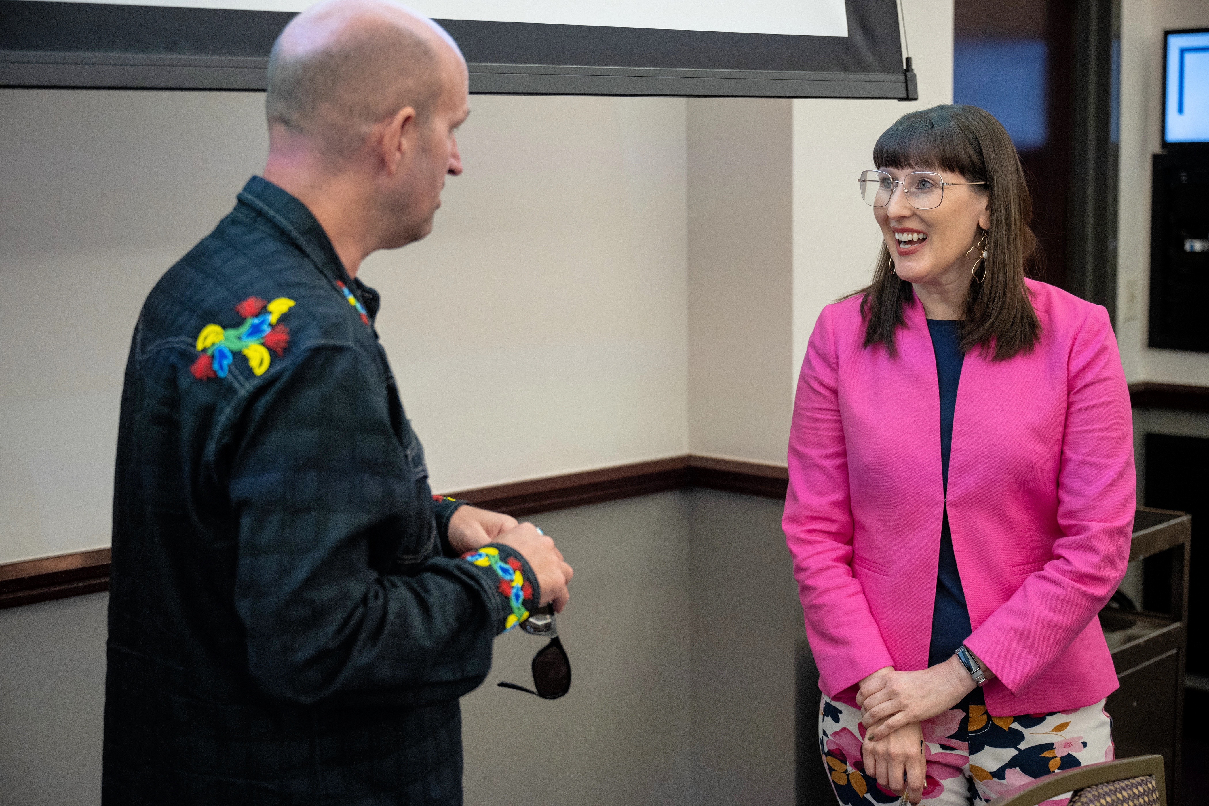 Jill Doerfler with lecture attendee