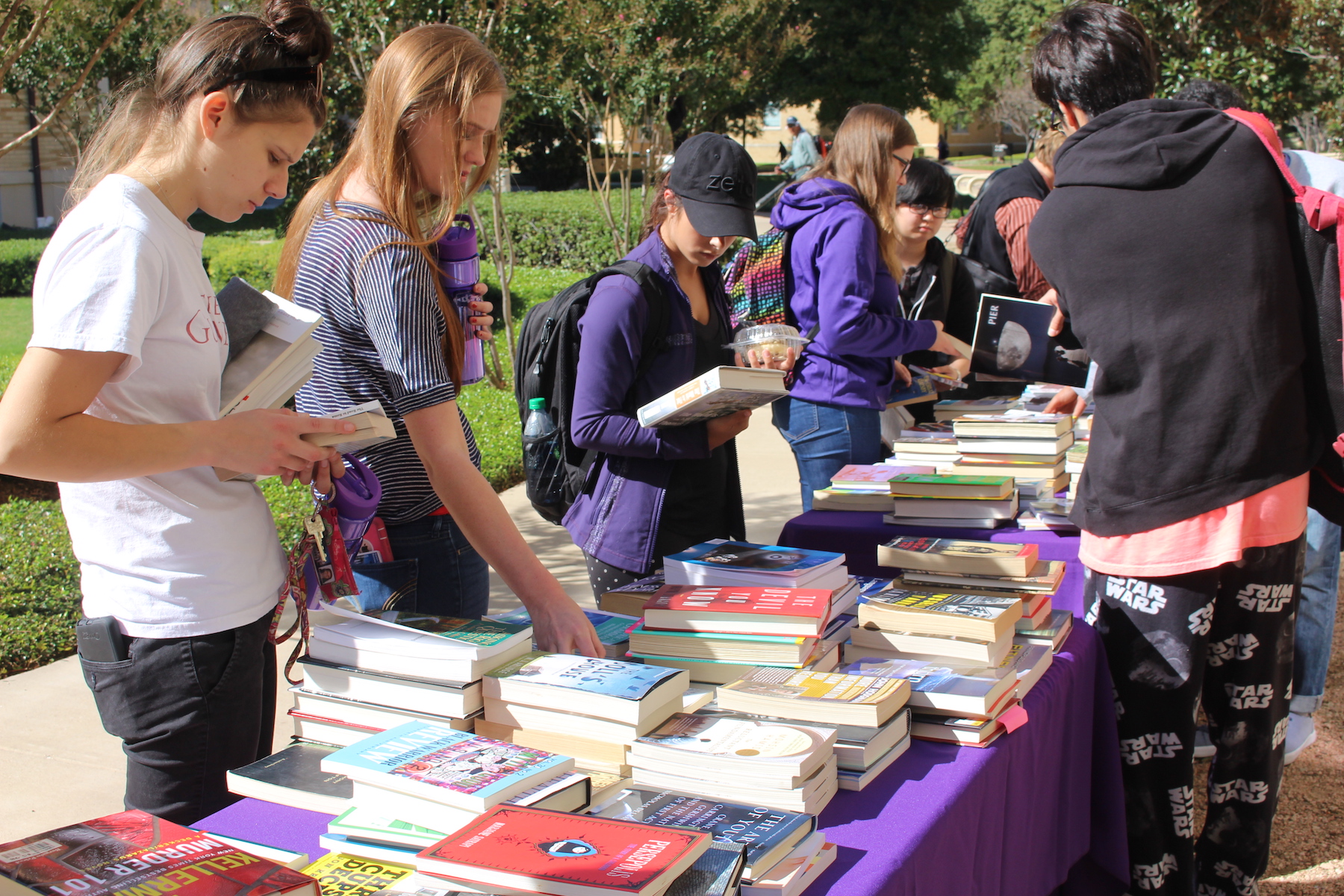 Students browse a free book drive