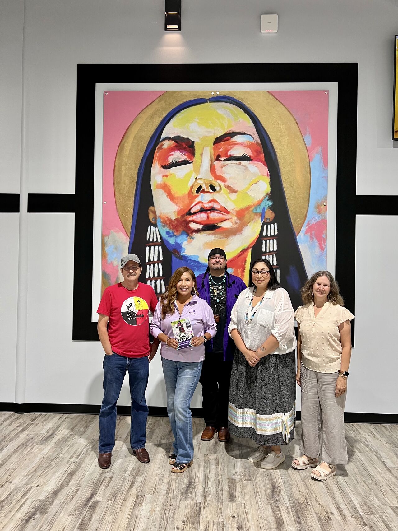 Co-editors and contributors celebrate the publication of Being in Relation: Indigenous Peoples, the Land, and Texas Christian University, 1873-2023 at Texas Native Health in Dallas in June.  L to r: Scott Langston (retired TCU Native Nations and Communities Liaison), Tabitha Tan (class of 1999 and one of the founders of TCU’s Native Student Association), Albert Nungaray (class of 2017), Jodi Voice Yellowfish (community partner and chair of MMIW-Texas Rematriate) and Gaul.
