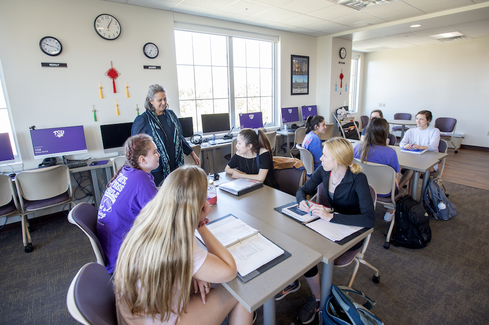 Students smile during a lesson in the Center for Language and Culture
