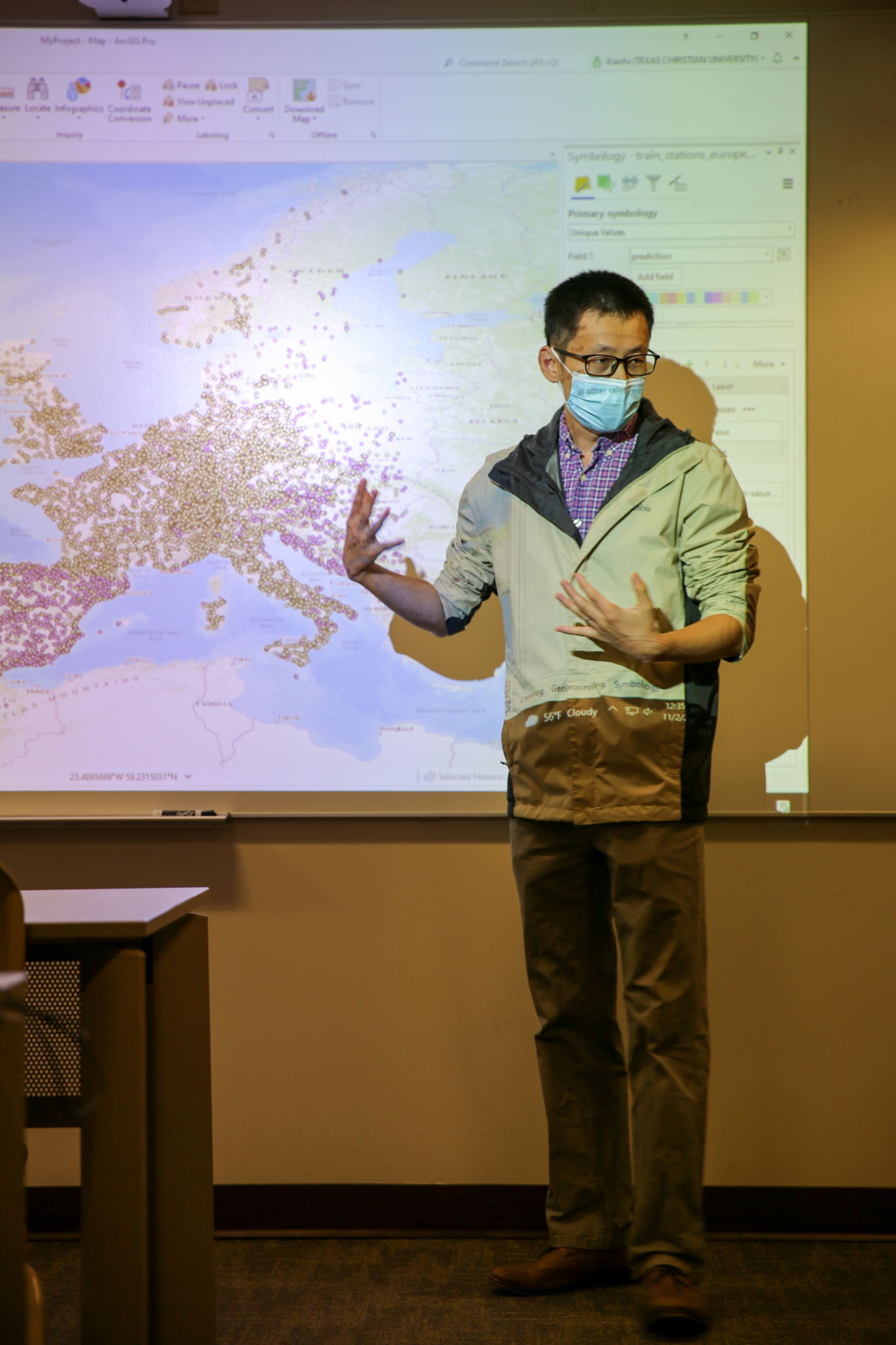 Xiaolu Zhou, Ph.D., instructs geography students in 202.1