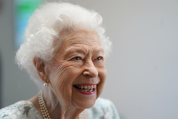 Queen Elizabeth II smiling (Photo by Kirsty O’Connor-WPA Pool/Getty Images)