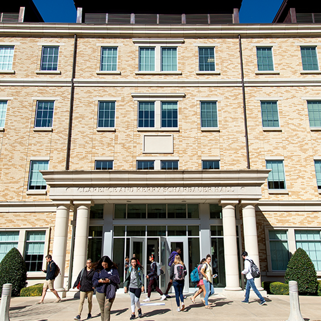 Students walking outside Scharbauer Hall in 2019. 