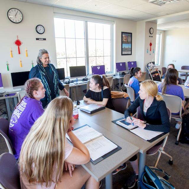 Students smile during a lesson in the Center for Language and Culture