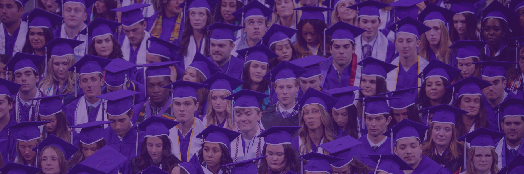 Graduates sitting at TCU's spring commencement ceremony.