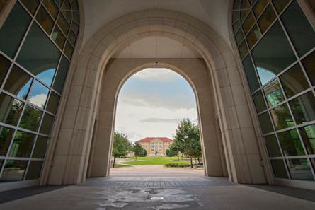 An archway looking at the TCU commons
