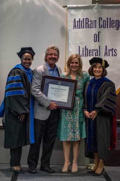Dr. David Schmidt (second from left), L.Cpl. Benjamin Schmidt's father, receives an honorary Bachelor of Art in History degree after the Keynote address at the 2022 Schmidt Symposium. Alongside Dr. Schmidt are (from left to right): Sonja Watson, Ph.D., dean of the AddRan College of Liberal Arts; Kara Dixon Vuic, Ph.D., LCpl. Benjamin W. Schmidt Professor of War, Conflict, and Society in 20th-Century America; TCU Provost Teresa Abi-Nader Dahlberg, Ph.D.
