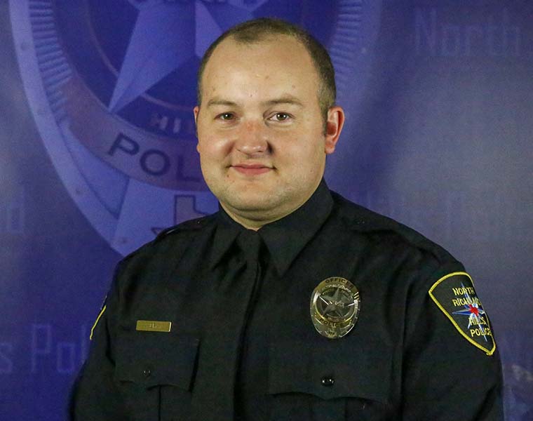 Andrew Bray '21 sits for his North Richland Hills Police Department headshot. Credit Andrew Bray