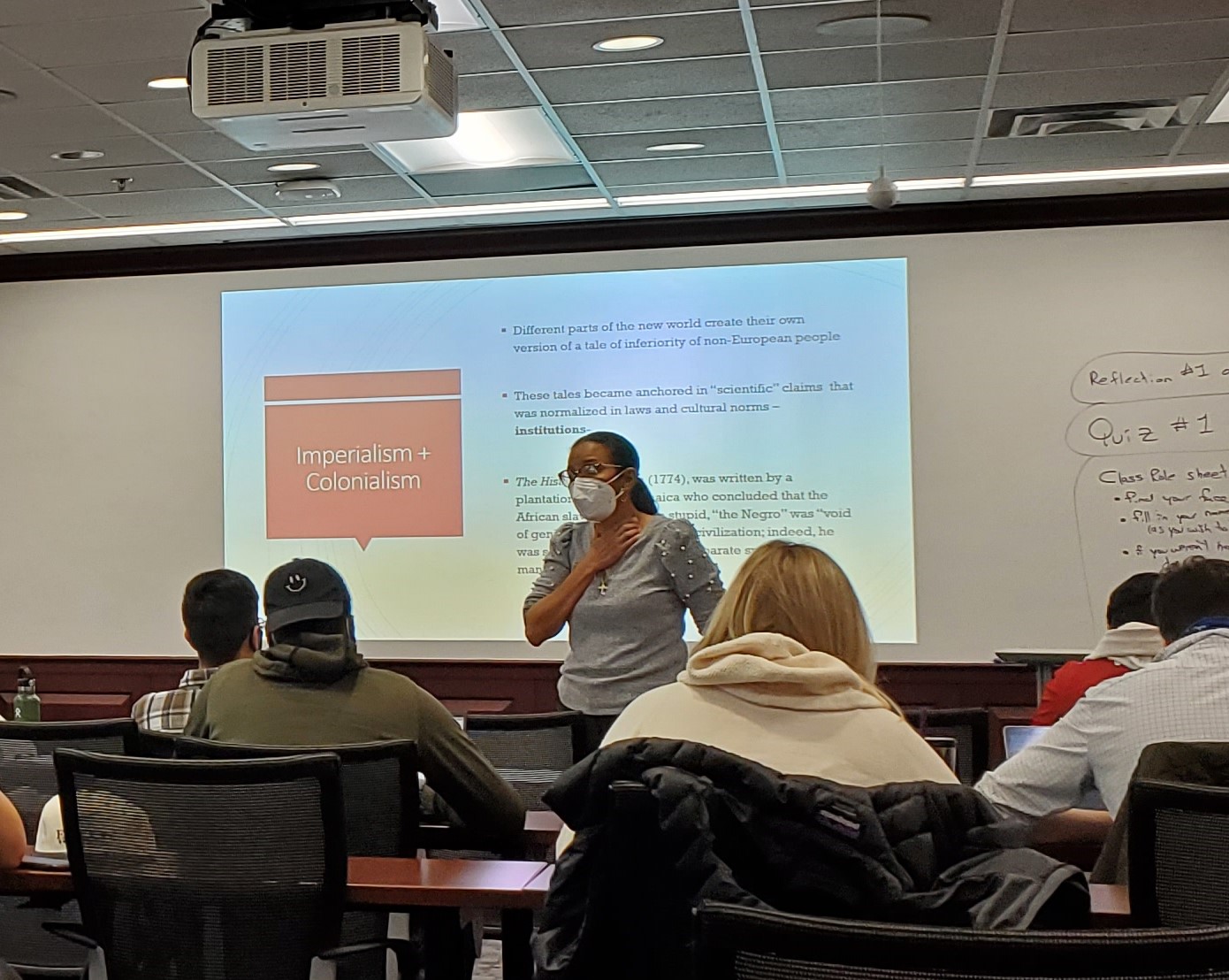 Dawn Elliott, Ph.D. instructs students in her Economics of Race, Ethnicity and Gender class. Credit John Harvey, Ph.D.