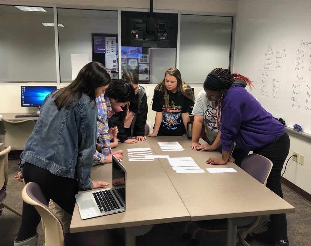 Students work in TCU's Center for Digital Expression on The Women's Center chapbook layout. Credit: Chantel L. Carlson, Ph.D.