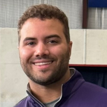 Alex Thompson smiling for a picture.