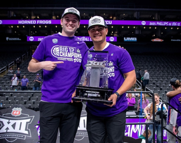 Ethan Gray, left, with fellow basketball manager David Cortez holding the Big 12 Tournament trophy.