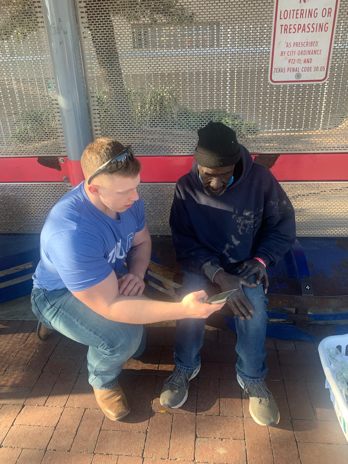 A volunteer speaks with an unsheltered homeless resident of Fort Worth's Lancaster Avenue area. Photo credit: Brie Diamond, Ph.D.