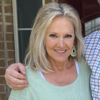 Judy Altenberg smiling for a picture.