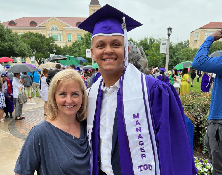 Kyle Fields and his mother take a picture at Kyle's undergraduate commencement ceremony.