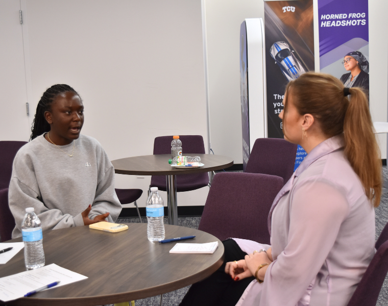 TCU students participate in small-group mock interview sessions with employers.